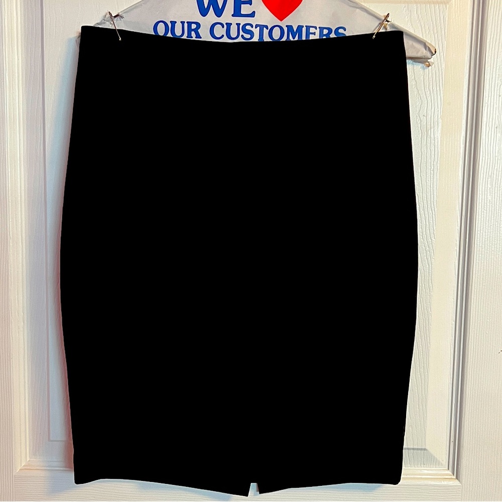 Bebe Mini Black lined Pencil Skirt With Slit . Size 6